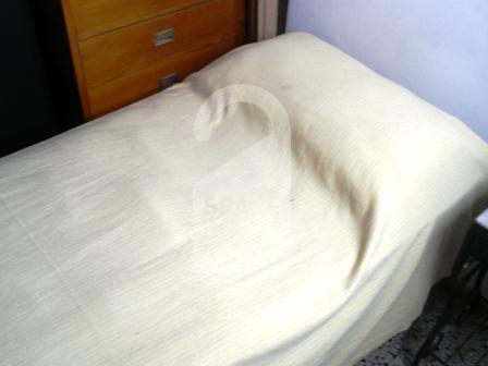 The bedroom at the apartment in Palermo