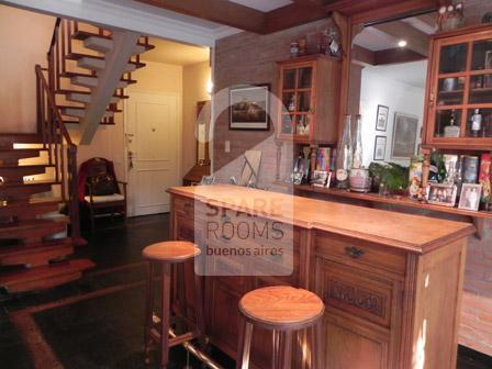 The bar and the entrance of the apartment in Belgrano
