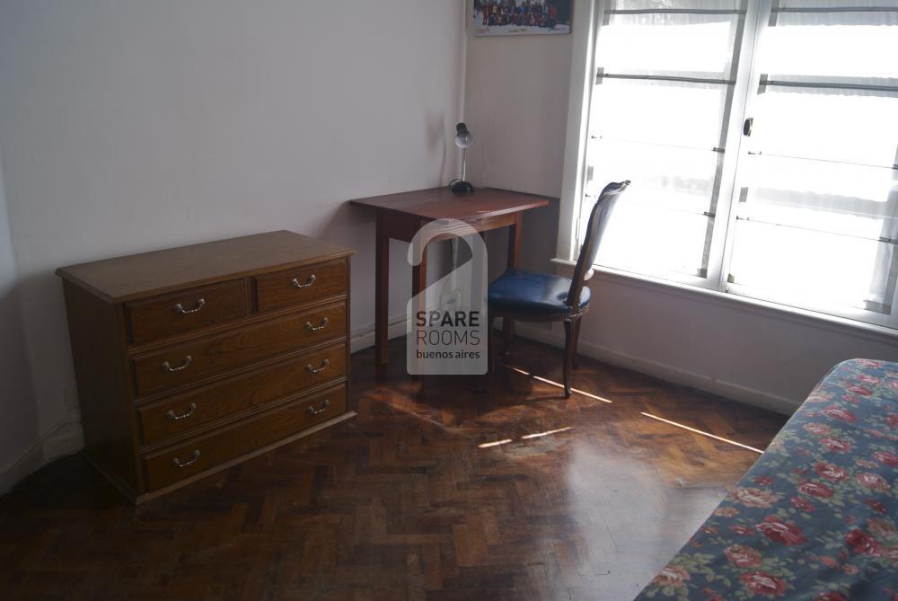 The desk and chest of drawers.